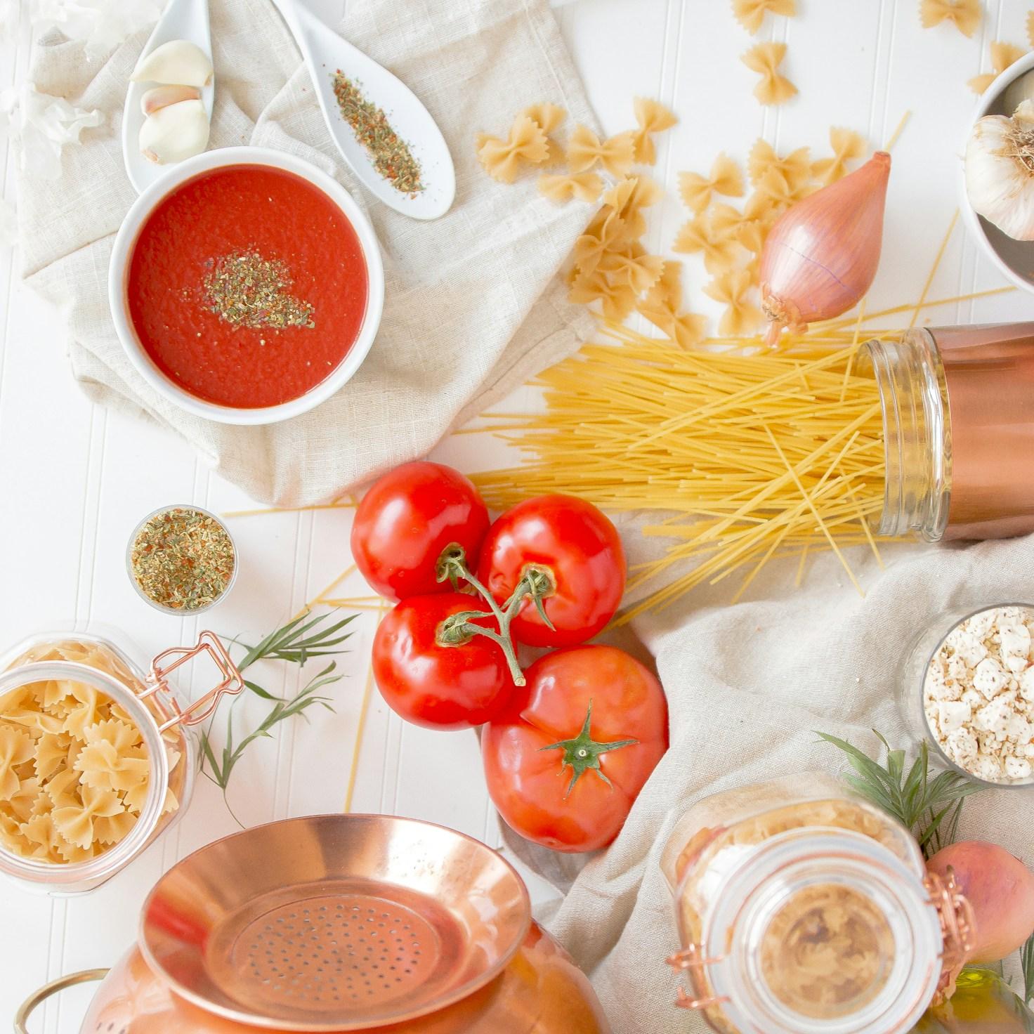 Community members collaborating in a contemporary kitchen space, exchanging recipes and cooking techniques